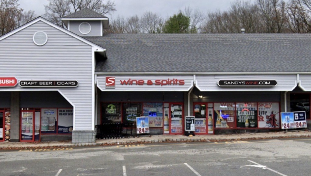 Crossroads Center before renovation — dated light-gray siding facade
