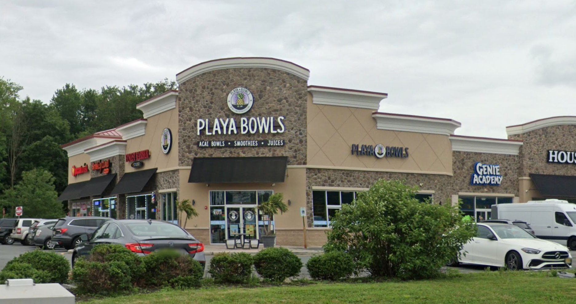 The former Rite Aid box today — a fully-leased multi-tenant strip center anchored by Playa Bowls, with a barber shop, tutoring center, and other internet-proof service tenants